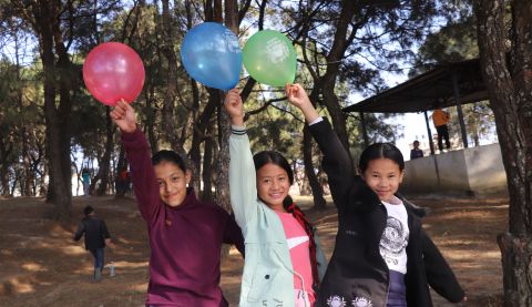 Samiksha (pictured middle) playing with friends in Kathmandu, Nepal