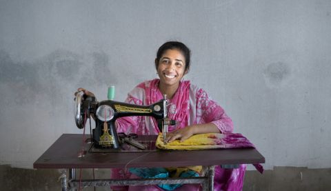 Moriom, 27, a mother of two who survived the Rana Plaza collapse. She accessed training and received a sewing machine from ActionAid's partner to help her back into work.