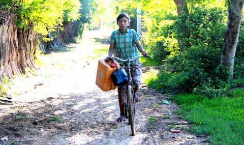 Girls in parts of Myanmar fetch water as part of their household tasks.