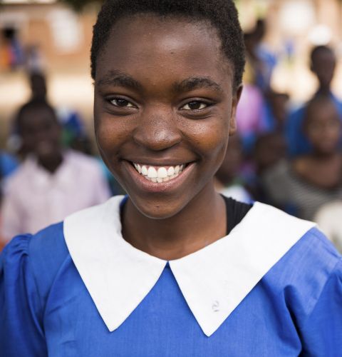 Vast, aged 17, at her school in Malawi