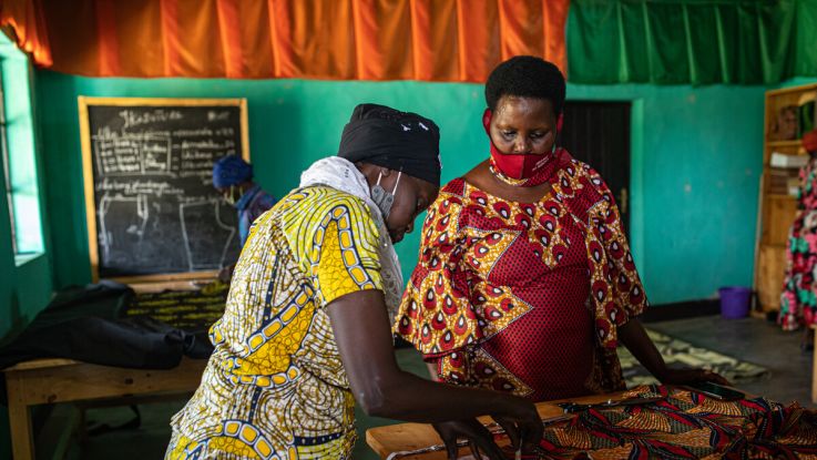 Immaculee and Amina working together at their cooperative The Light of Nyanza