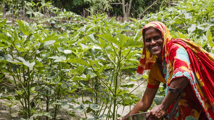 Nazma, 30, in her garden in a flood-proof village next to Samat Maddever Village, Faridpur.